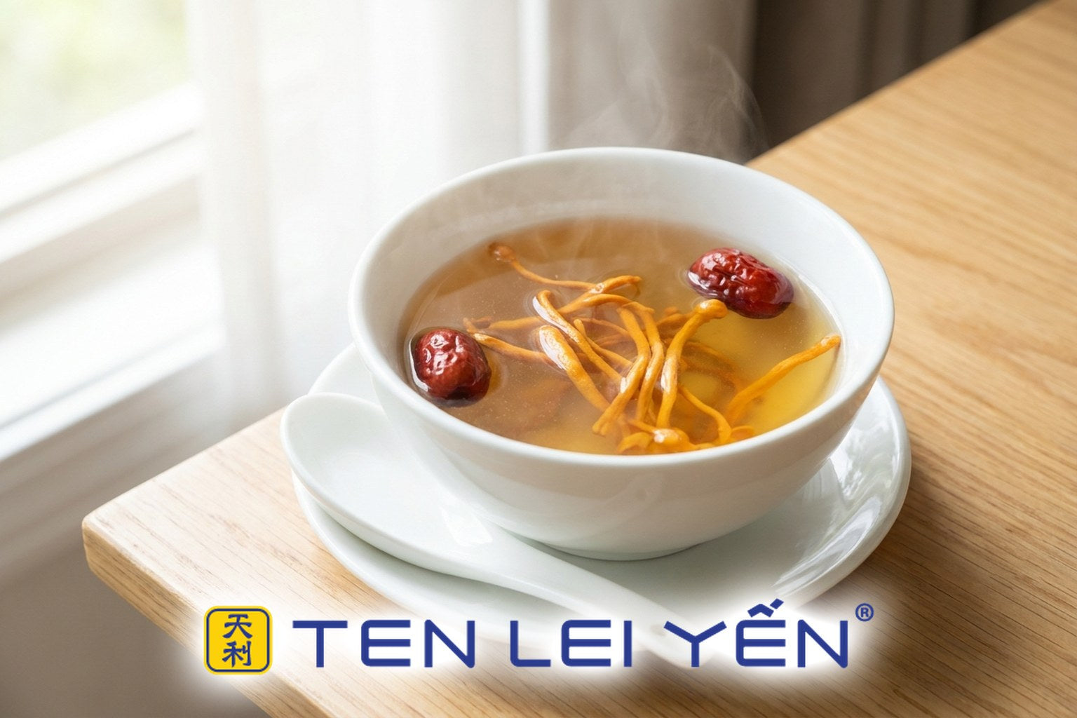A clear golden double-boiled cordyceps broth in a white porcelain bowl with orange-gold cordyceps militaris and red dates