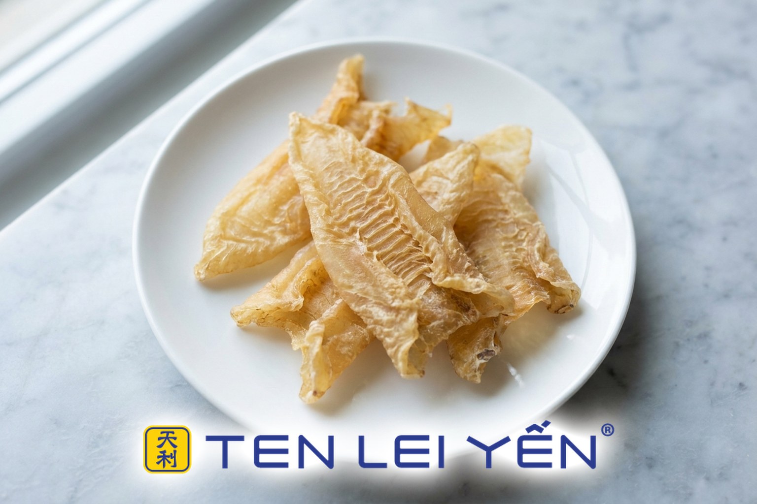 Dried fish maw pieces on a white porcelain plate