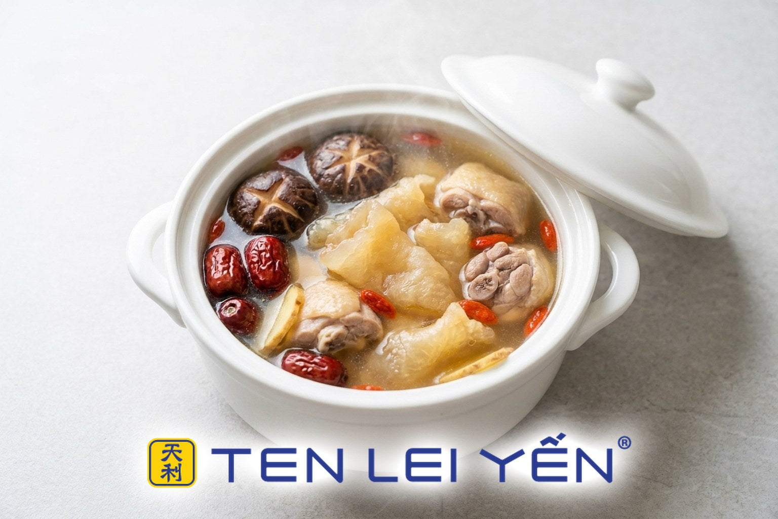 Double-boiled fish maw and chicken soup with shiitake mushrooms, red dates and goji berries in a white porcelain tureen