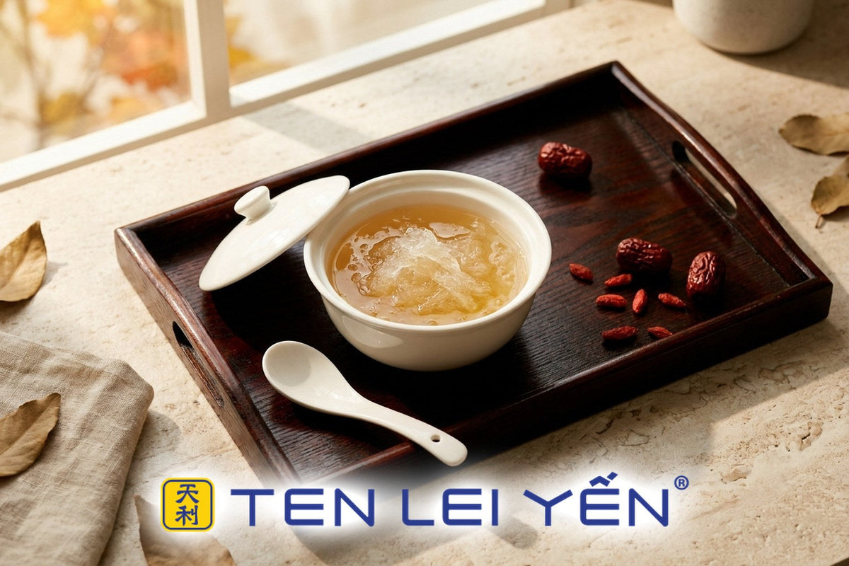 Small lidded white porcelain bowl of cooked bird's nest with red dates on a lacquered tray, Hong Kong dessert-shop style serving