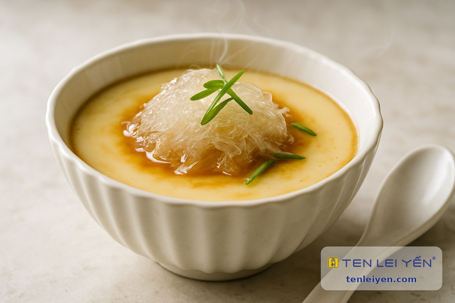 Silky savory steamed egg with edible bird's nest in a fluted white porcelain bowl