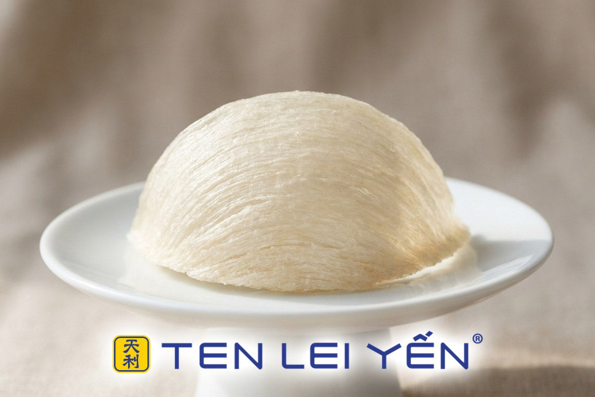 Single dried bird's nest styled on a white porcelain pedestal dish