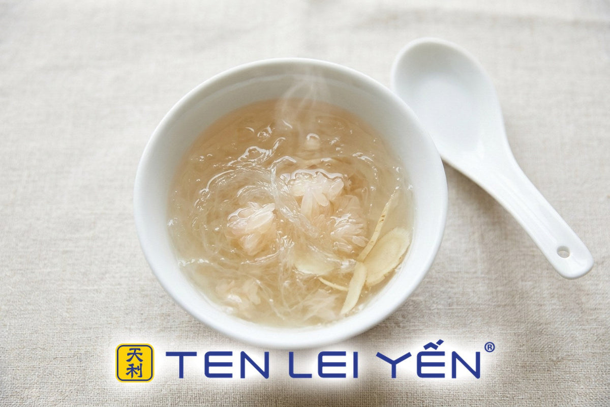 A warm bird's nest with pomelo and ginseng, overhead in a white porcelain bowl