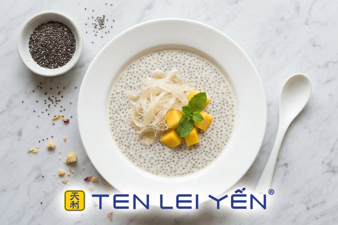 Chilled bird's nest chia pudding in a white porcelain bowl topped with translucent bird's nest strands, mango, and mint
