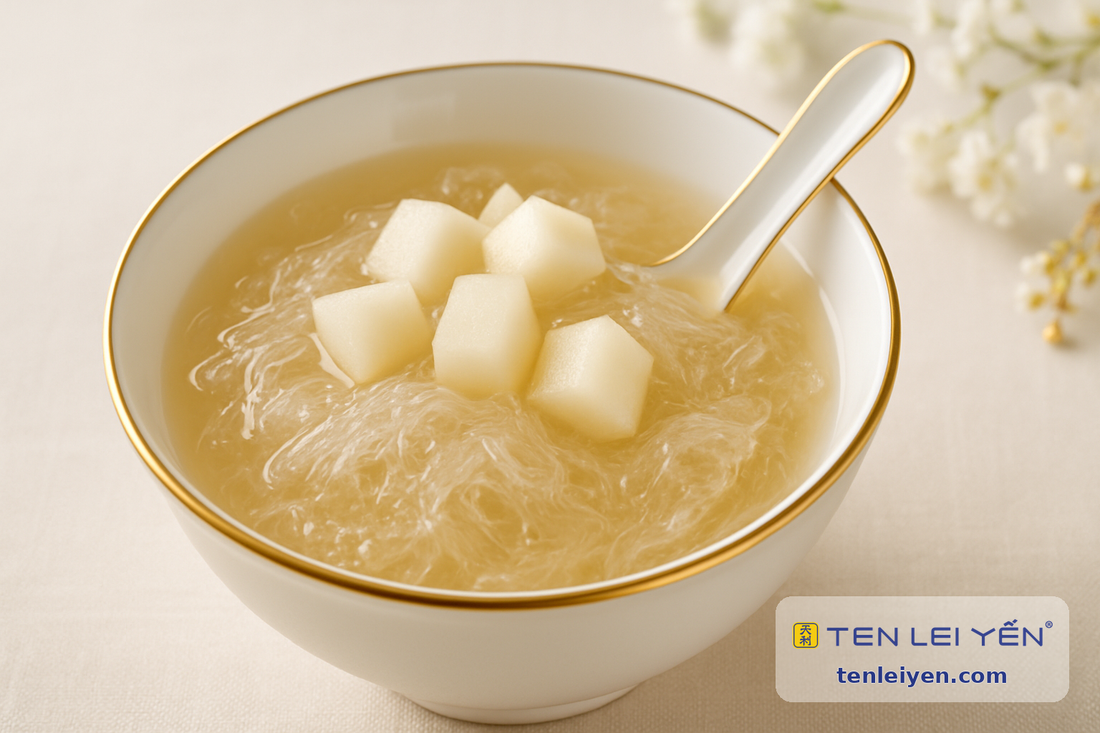 Chilled edible bird's nest dessert with fresh Asian pear in a gold-rimmed porcelain bowl