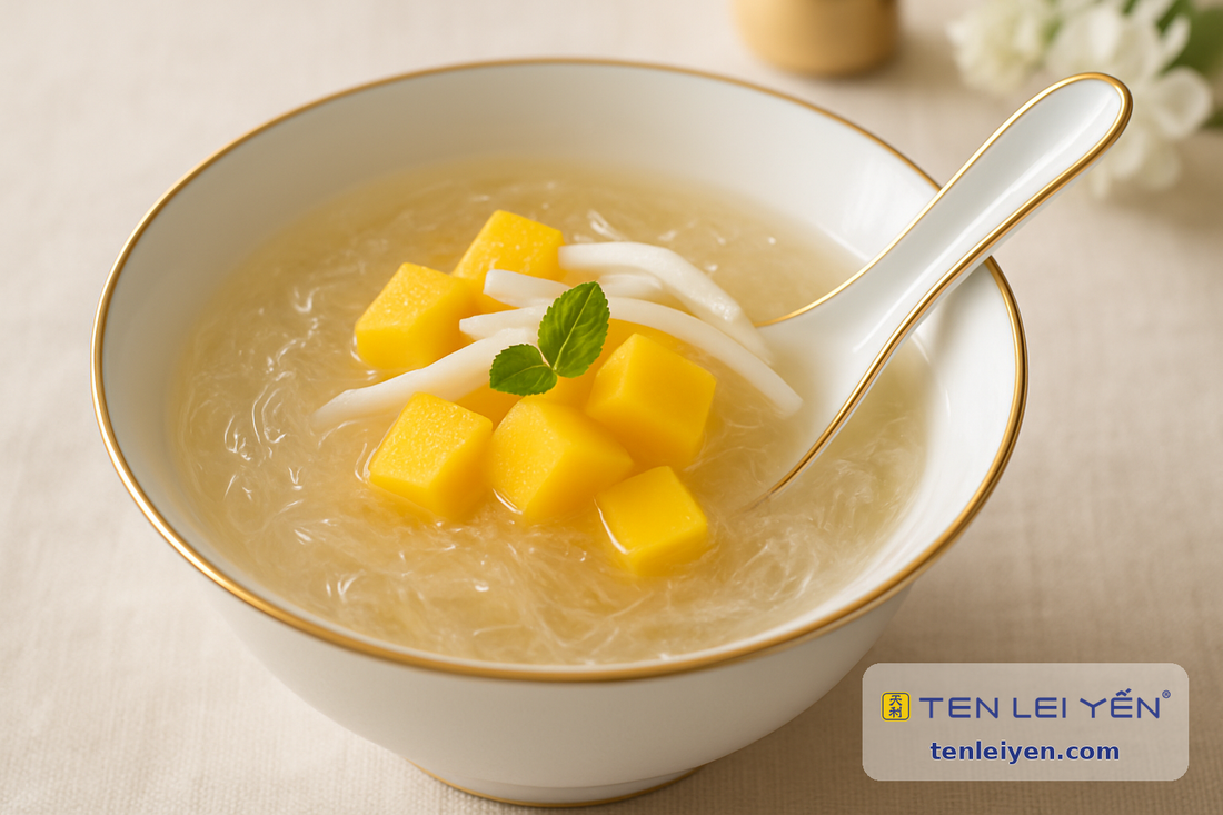 Chilled edible bird's nest dessert with fresh mango and coconut in a gold-rimmed porcelain bowl