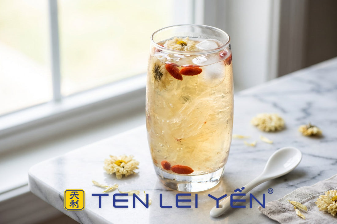 Tall glass of chilled chrysanthemum and goji bird's nest drink with translucent nest strands and ice
