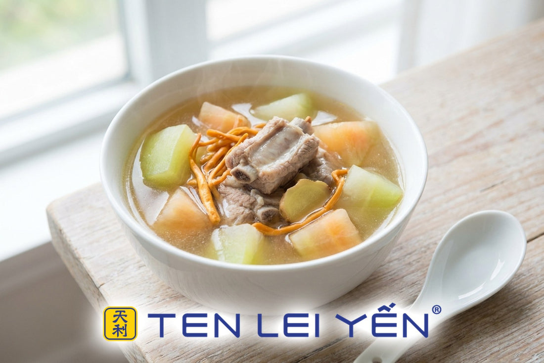 Clear green papaya and pork rib soup with cordyceps flower in a white porcelain bowl