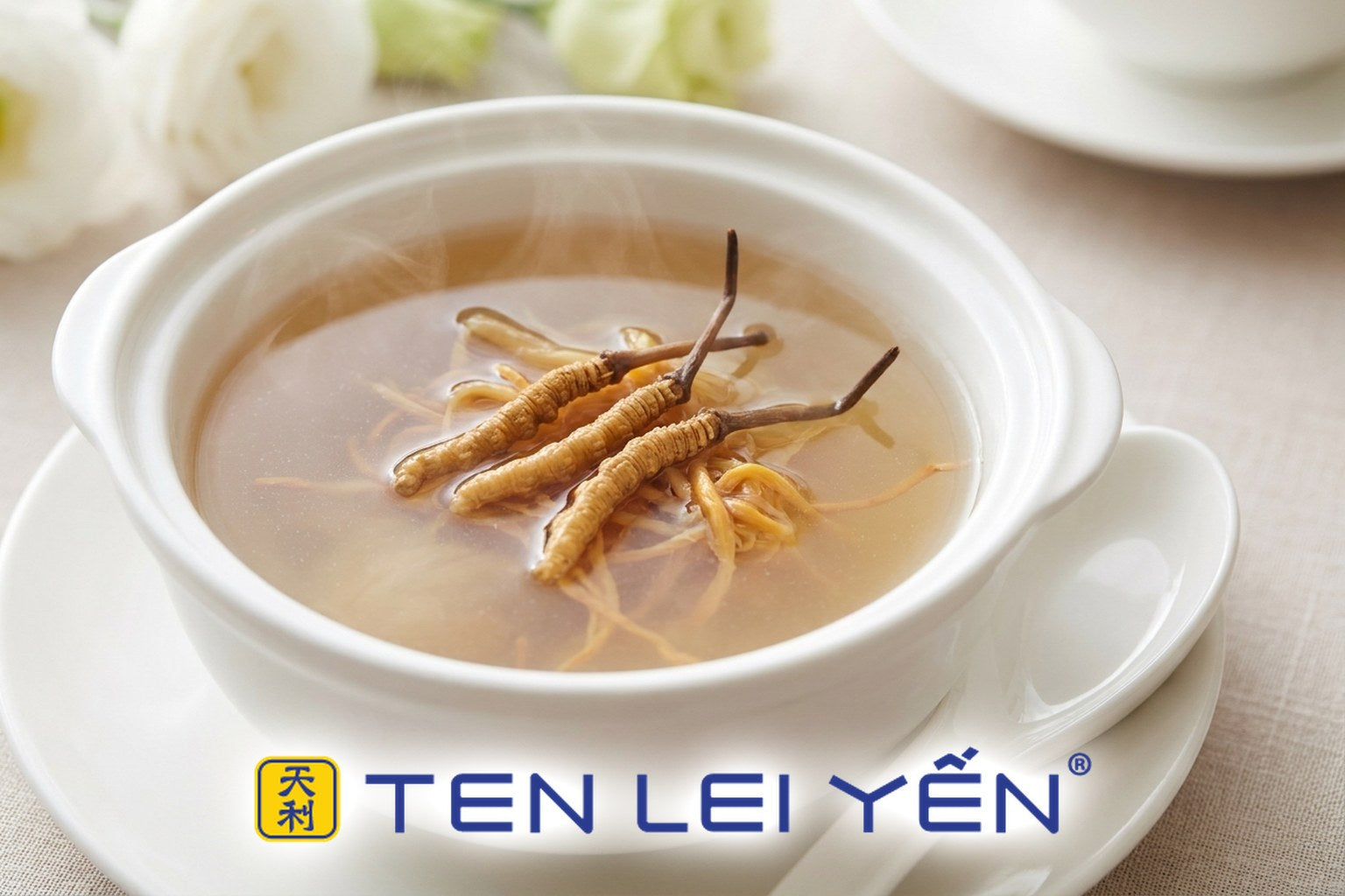Clear double-boiled wild cordyceps and dried scallop soup in a white porcelain bowl with whole cordyceps pieces visible