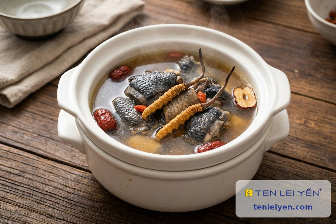 Double-boiled cordyceps and silkie chicken soup with whole wild cordyceps, red dates, and goji in a white pot