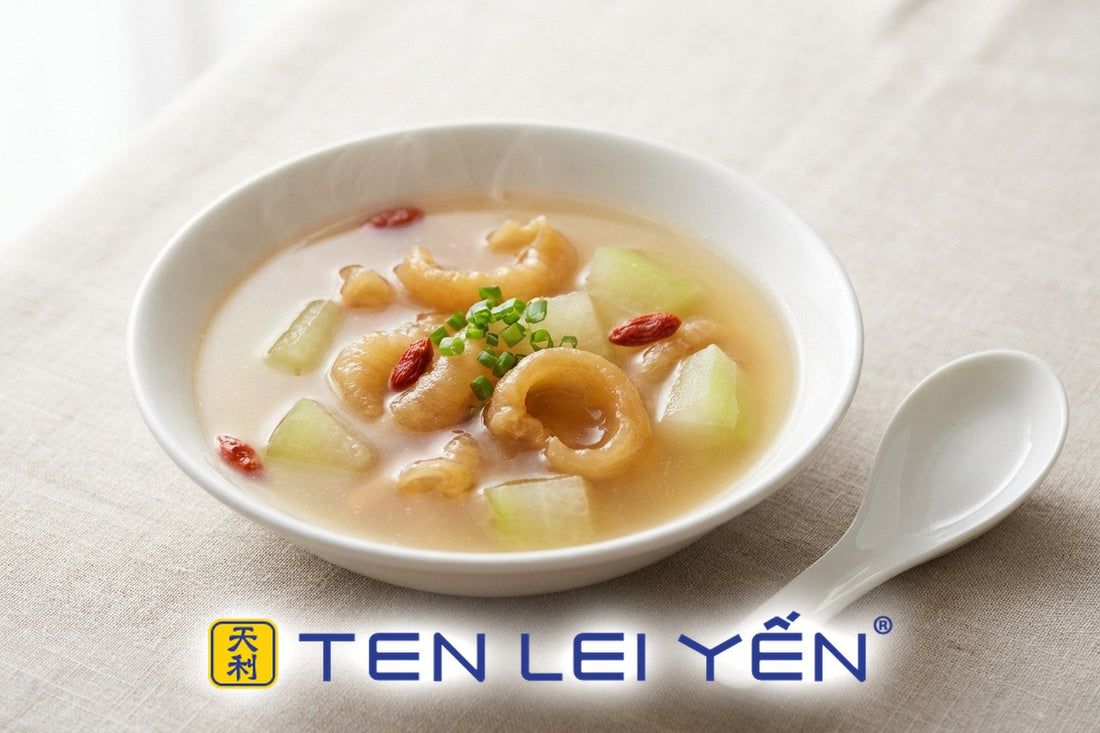 Fish maw and winter melon soup with goji berries in a white porcelain bowl