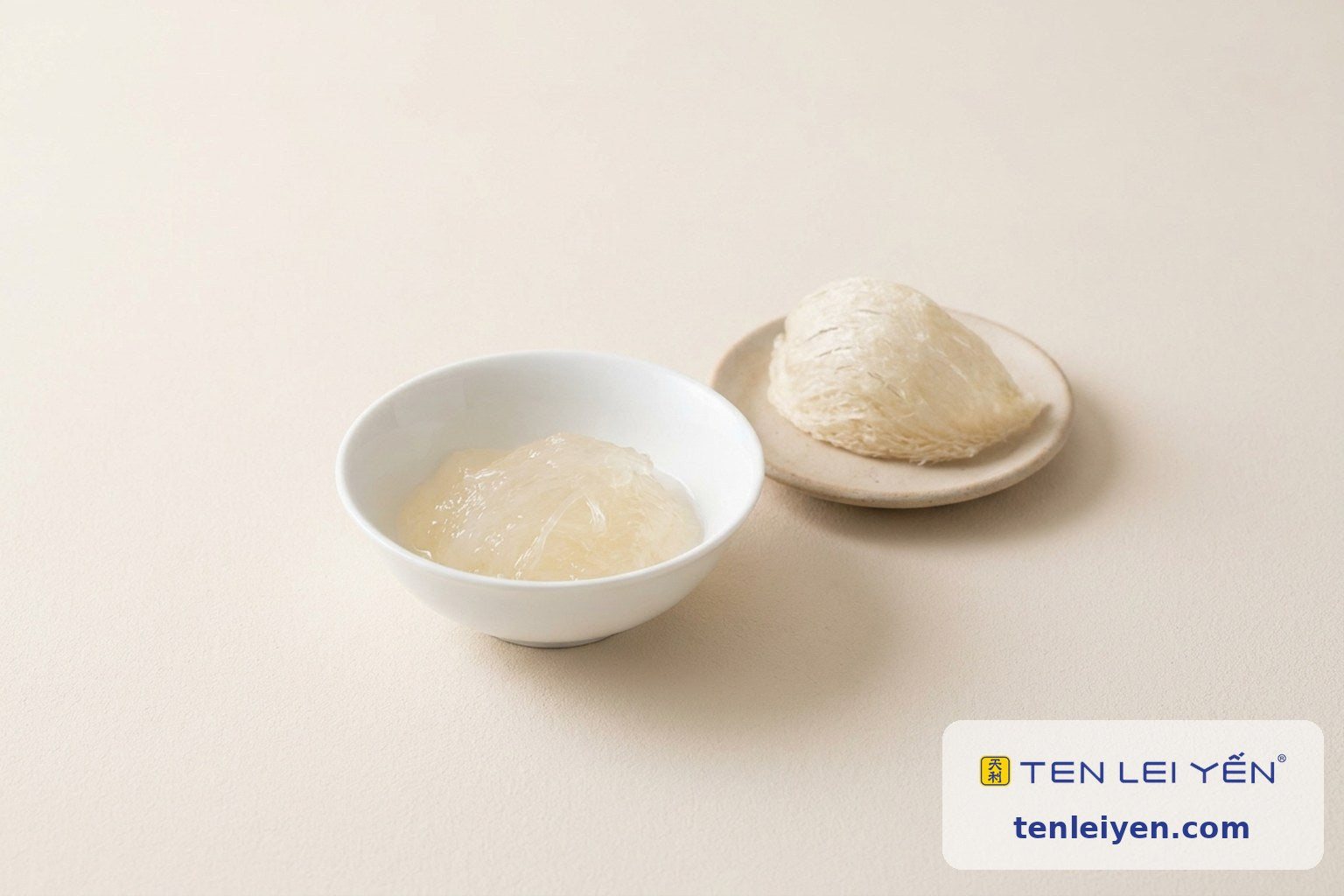 A small bowl of prepared bird's nest beside a dried bird's nest half showing a single serving