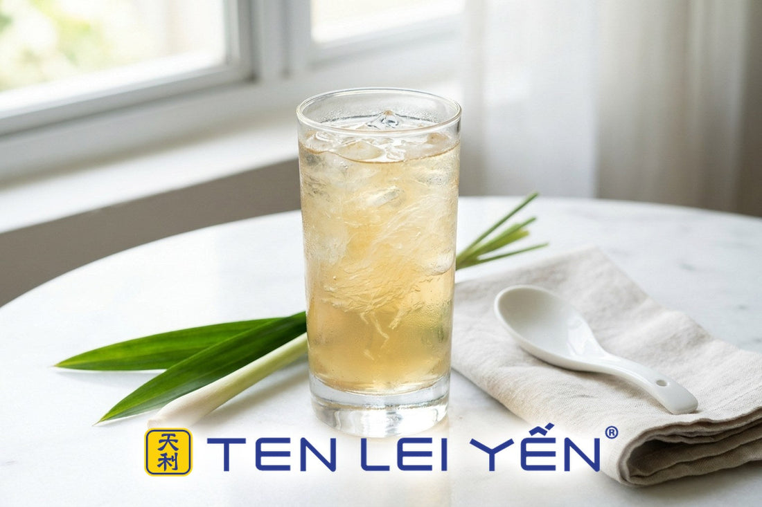 Chilled lemongrass bird's nest drink with translucent nest strands over ice in a tall glass