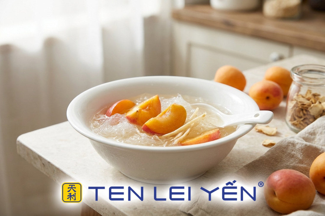 Chilled bird's nest with fresh apricot slices and ginseng slivers in a white porcelain bowl