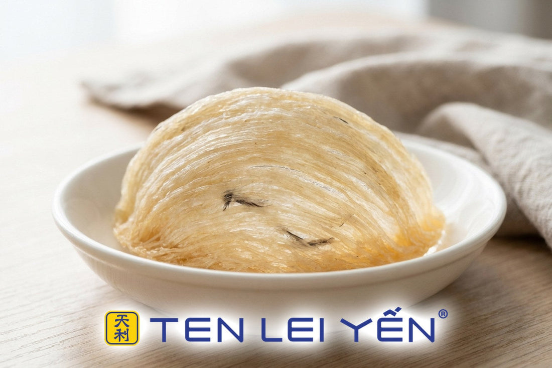 Genuine dried edible bird's nest cup with a few fine feather flecks in a white porcelain dish