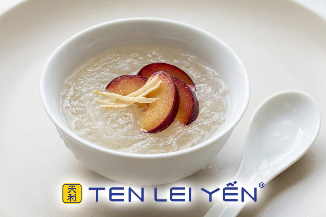 Chilled bird's nest with fresh red plum slices and thin ginseng slices in a white porcelain bowl