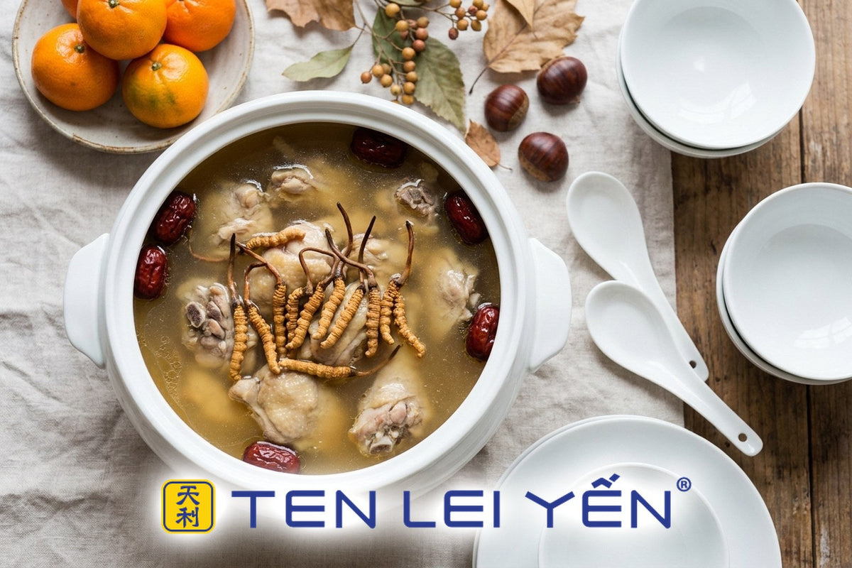 Double-boiled chicken soup with wild cordyceps pieces in a white porcelain tureen set for a Mid-Autumn reunion dinner