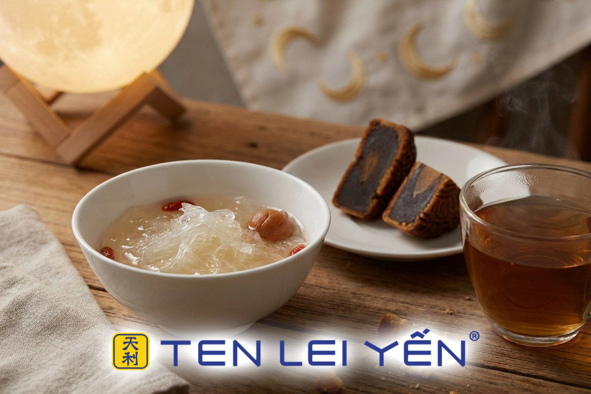 White porcelain bowl of bird's nest dessert served with mooncakes and tea for a Mid-Autumn reunion table