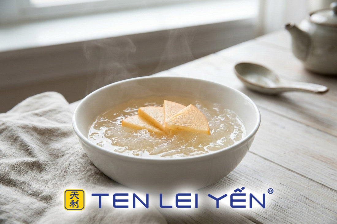 Warm double-boiled bird's nest with sliced Fuyu persimmon in a white porcelain bowl