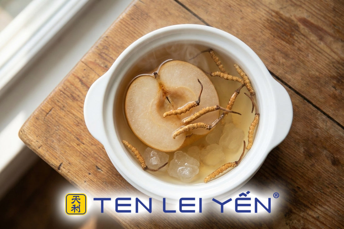 Wild cordyceps and Asian pear soup served in white porcelain bowls with pear halves and rock sugar broth