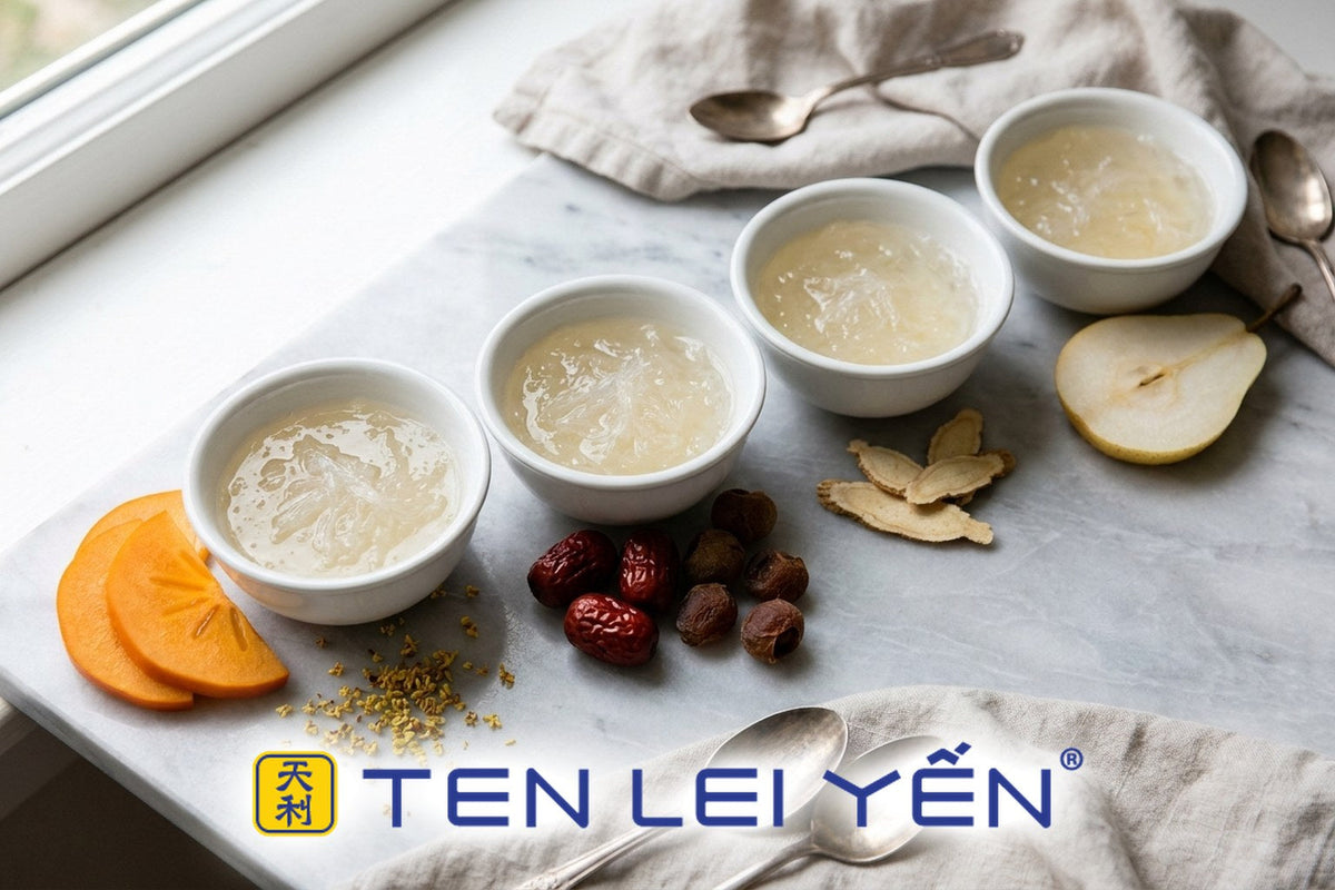 Four small white porcelain bowls of bird's nest arranged with seasonal pairings from persimmon to red dates